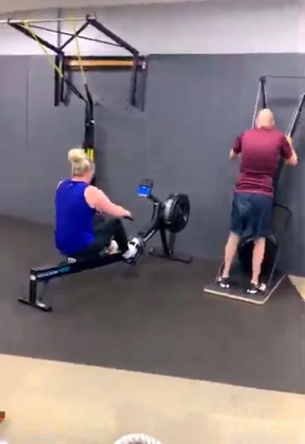 Chris and Stephanie training on the rowing and ski ergs at YES Fitness